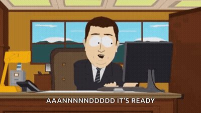 A Cartoon Of A Man Sitting In Front Of A Computer With The Words " It 'S Ready " Written Below Him GIF