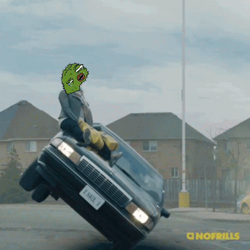 A Cartoon Of A Man Sitting On Top Of A Car With A License Plate That Says Thak 1 GIF