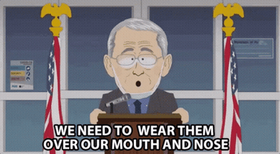 A Cartoon Of A Man Speaking At A Podium With The Words We Need To Wear Them Over Our Mouth And Nose GIF