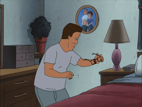 A Cartoon Of A Man Standing In Front Of A Picture Of His Family GIF