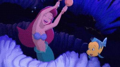 A Cartoon Of A Mermaid And A Fish Playing A Musical Instrument GIF