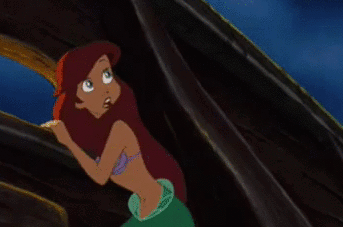 A Cartoon Of A Mermaid With Red Hair Is Standing In Front Of A Window GIF