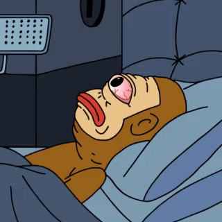 A Cartoon Of A Monkey Laying In A Bed With His Eyes Closed GIF