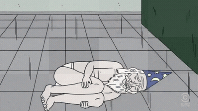 A Cartoon Of A Naked Man With A Wizard Hat Laying On The Ground GIF