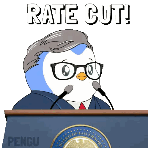 A Cartoon Of A Penguin Behind A Podium With The Words Rate Cut Sticker