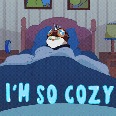 A Cartoon Of A Penguin Laying In A Bed With The Words I 'M So Cozy Below It GIF