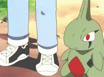 A Cartoon Of A Person Standing Next To A Green Monster GIF
