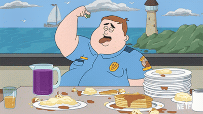 A Cartoon Of A Police Officer Sitting At A Table With Pancakes GIF