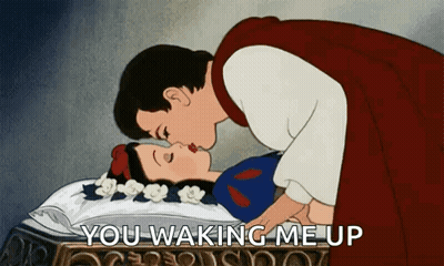 A Cartoon Of A Prince Kissing Snow White While She Is Sleeping GIF