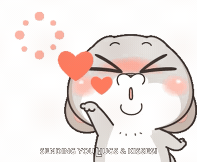 A Cartoon Of A Rabbit Blowing A Heart With The Words " Sending You Hugs & Kisses " Below It GIF