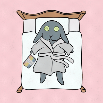 A Cartoon Of A Rabbit In A Bathrobe Laying On A Bed GIF