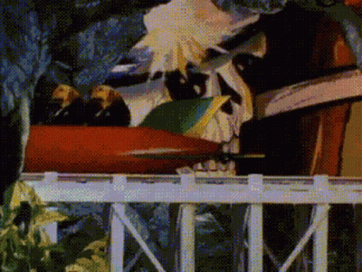 A Cartoon Of A Roller Coaster With A Skull On It GIF