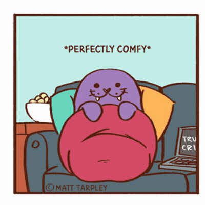 A Cartoon Of A Seal Sitting On A Couch With The Words Perfectly Comfy On The Bottom GIF