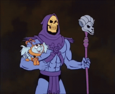 A Cartoon Of A Skeletor Holding A Small Animal GIF