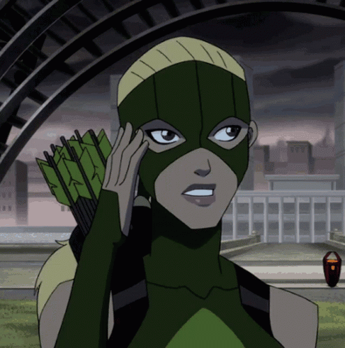 A Cartoon Of A Woman In A Green Mask Holding A Bow And Arrow GIF