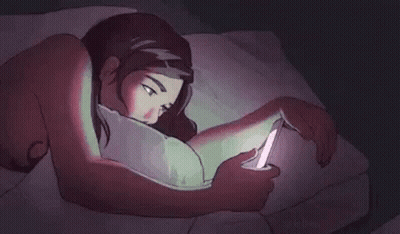 A Cartoon Of A Woman Laying In Bed Looking At Her Phone . GIF