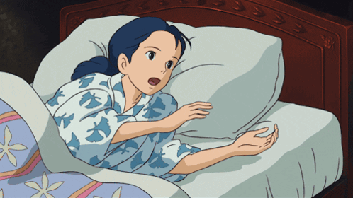 Woman Lying In Bed With Mouth Open GIF