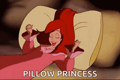 A Cartoon Of A Woman Laying On A Pillow With The Words Pillow Princess Written Above Her . GIF
