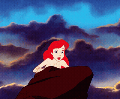 A Cartoon Of A Woman Sitting On A Rock GIF