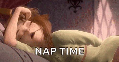 A Cartoon Of A Woman Sleeping On A Bed With The Words `` Nap Time '' . GIF