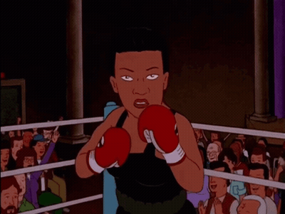 A Cartoon Of A Woman Wearing Boxing Gloves GIF