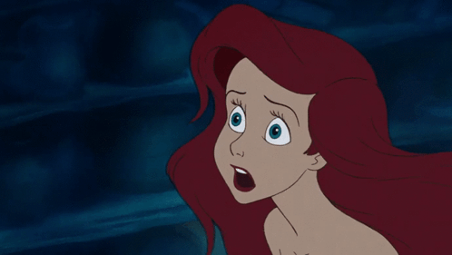 A Cartoon Of A Woman With Red Hair And Blue Eyes GIF