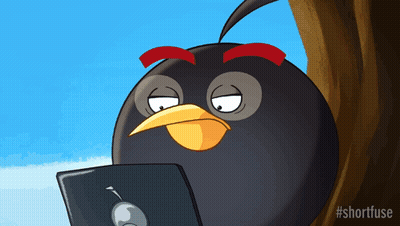 A Cartoon Of An Angry Bird Looking At A Laptop Computer GIF