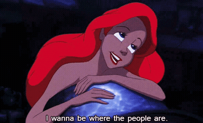 A Cartoon Of Ariel From The Little Mermaid Laying On A Rock With The Words I Wanna Be Where The People Are Below Her GIF