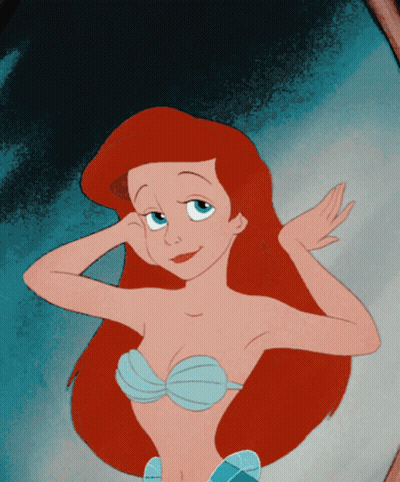 A Cartoon Of Ariel From The Little Mermaid Looking At Herself In The Mirror GIF