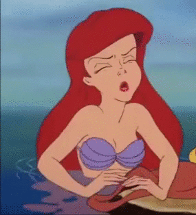 A Cartoon Of Ariel From The Little Mermaid Yawning In The Ocean . GIF