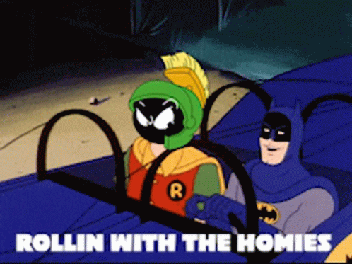 A Cartoon Of Batman And Marvin The Martian Riding In A Car GIF