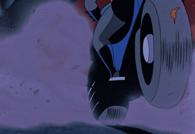 A Cartoon Of Batman Riding A Motorcycle GIF