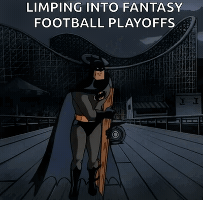 a cartoon of batman standing in front of a roller coaster with the words " limping into fantasy football playoffs " abov