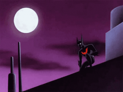 A Cartoon Of Batman Standing On Top Of A Building At Night . GIF