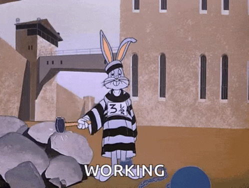 A Cartoon Of Bugs Bunny In A Jail Cell Holding A Hammer With The Word Working Below Him GIF