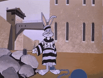 A Cartoon Of Bugs Bunny In A Jail Cell With A Hammer . GIF