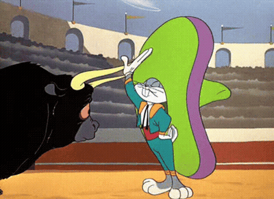 A Cartoon Of Bugs Bunny In A Sombrero Fighting A Bull GIF
