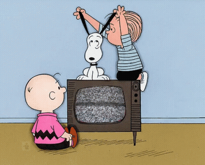 A Cartoon Of Charlie Brown And Snoopy Looking At A Television GIF