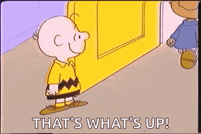 A Cartoon Of Charlie Brown Kissing Another Cartoon Character With The Words That 'S What 'S Up ! GIF