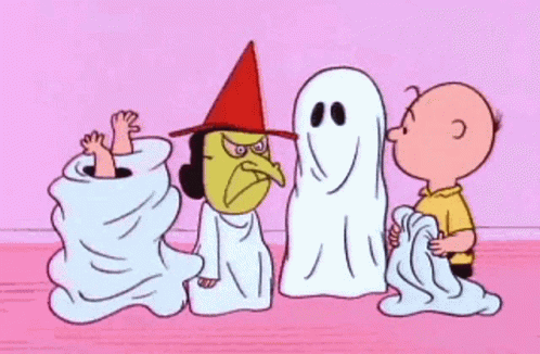 A Cartoon Of Charlie Brown , Snoopy , And A Witch Standing Next To Ghosts . GIF