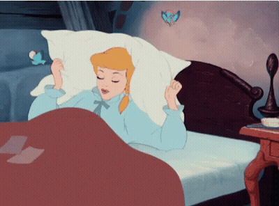 A Cartoon Of Cinderella Laying In Bed With Her Eyes Closed GIF