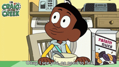 A Cartoon Of Craig From Craig Of The Creek Sitting In A Chair Next To A Box Of Raisin Nuts GIF