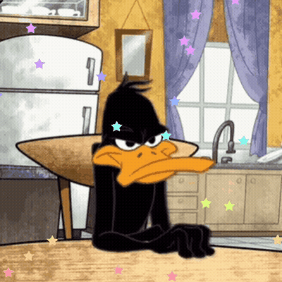A Cartoon Of Daffy Duck Sitting At A Table GIF