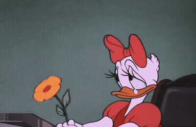 A Cartoon Of Daisy Duck Holding A Flower In Her Hand GIF