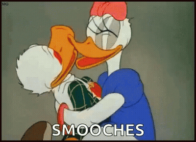 A Cartoon Of Donald Duck And Daisy Duck Hugging Each Other With The Words Smooches Above Them GIF