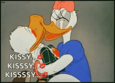 A Cartoon Of Donald Duck And Daisy Duck Kissing Each Other . GIF