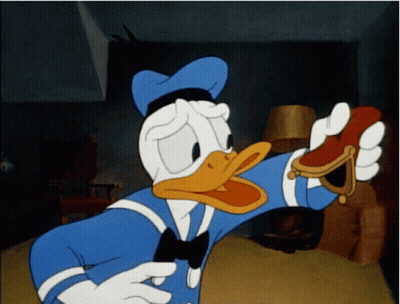 A Cartoon Of Donald Duck Holding A Red Object GIF