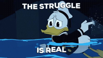 A Cartoon Of Donald Duck In The Water With The Words " The Struggle Is Real " Above Him GIF