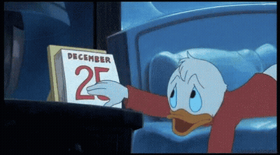 A Cartoon Of Donald Duck Looking At A Calendar That Says December 25 GIF