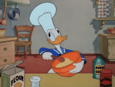 A Cartoon Of Donald Duck Mixing Something In A Bowl With A Box Of Flour In The Background GIF